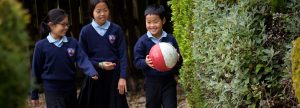 a child holding a ball