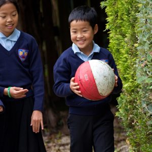 a child holding a ball