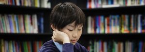 boy focusing on his work