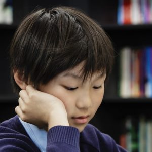 boy focusing on his work