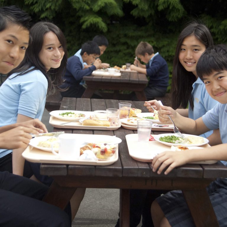 students eating their lunch outdoors