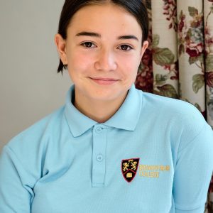 child in her school uniform