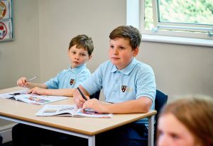 boys sat at their desk