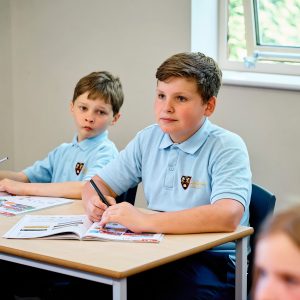 boys sat at their desk