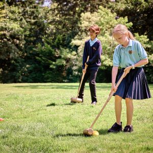 children holding sticks