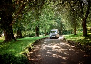 school bus driving up a path