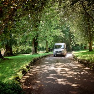 school bus driving up a path