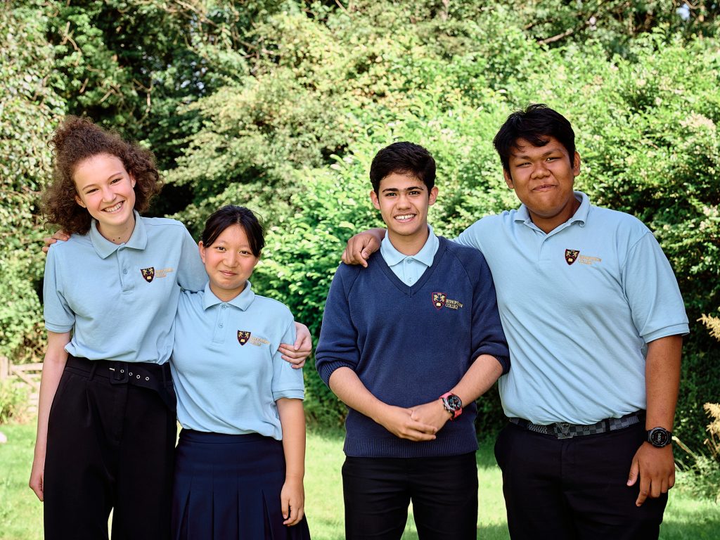 Students stood in a group smiling