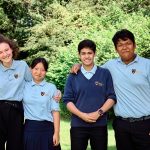 Students stood in a group smiling