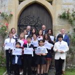 Group of children holding certificates