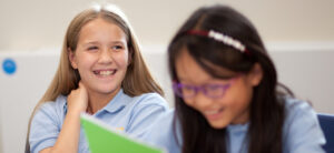 girls laughing in class